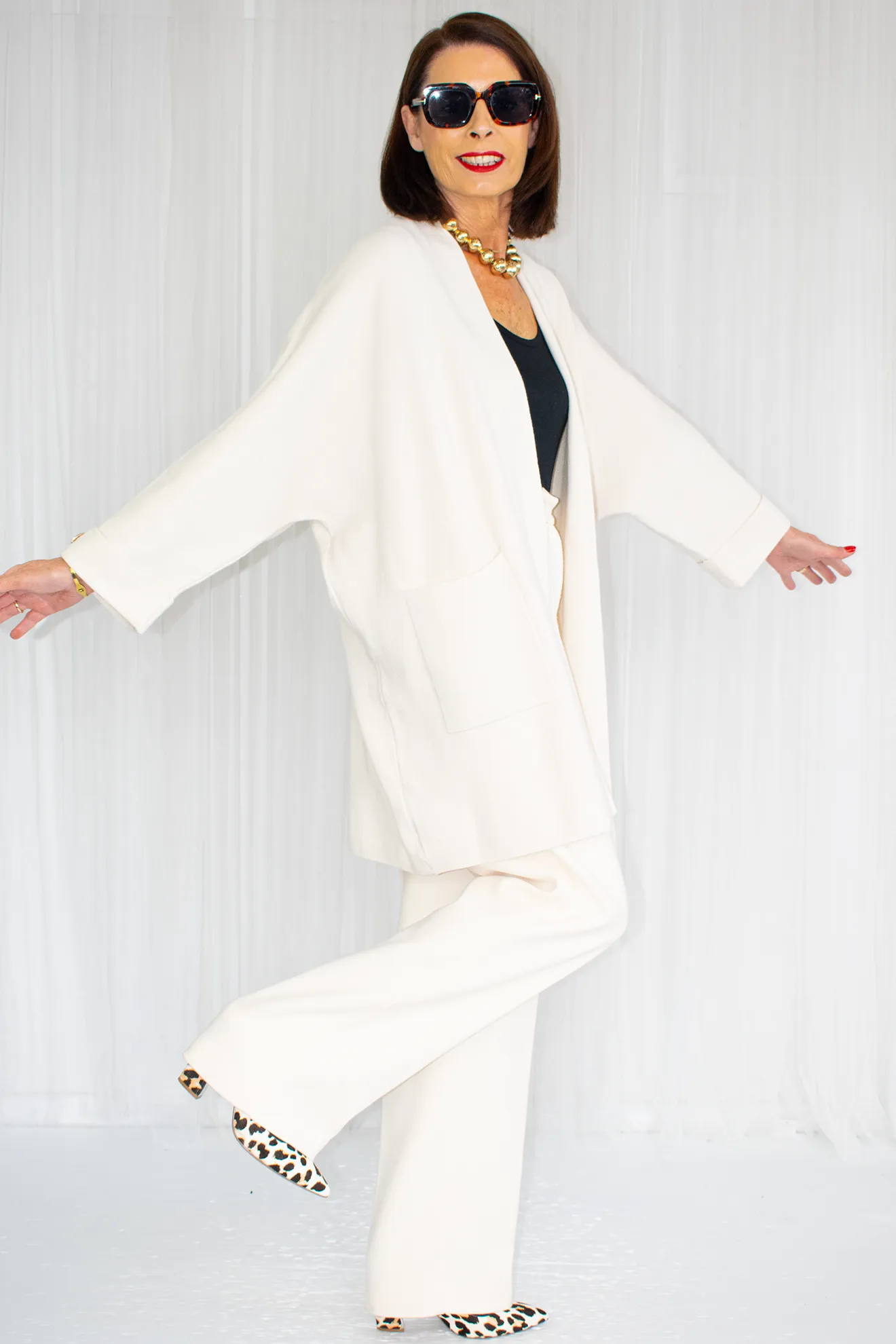 Diana Mid Length Knit Jack with gold accent in cream